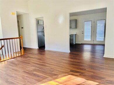 Spare room featuring hardwood / wood-style floorin