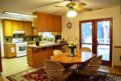 The kitchen is open to the dining nook, which feat