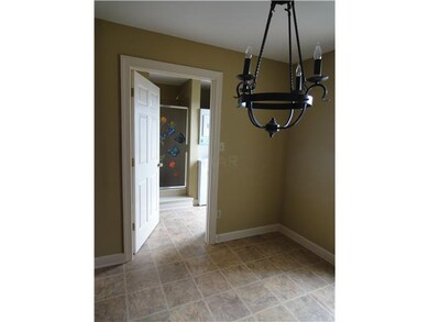 Breakfast area with door leading to full bath and 
