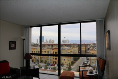 Living room with downtown and mountain views