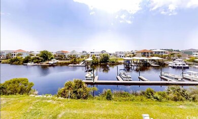 Dock with a water view and a residential view