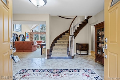 Foyer featuring circular stairway