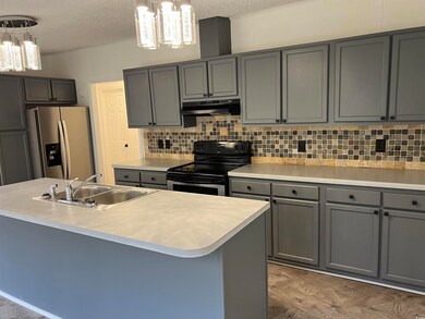 Kitchen with decorative light fixtures, stainless 