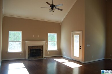 Bright sunny living room with vaulted ceilings fea