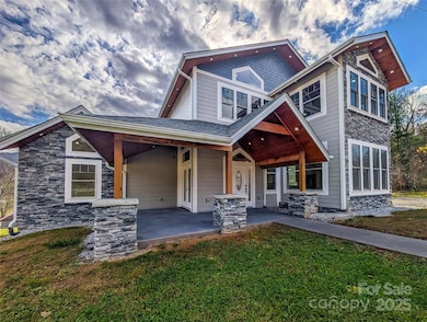 Covered porch with tongue & groove ceiling invites you inside!