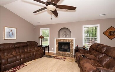 Family Room with vaulted ceiling, hardwoods and ga