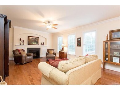 Family Room with gas fireplace, beautiful hardwood