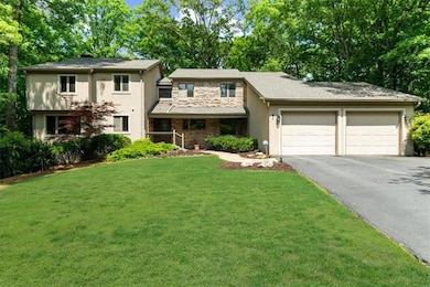 View of front of property featuring an attached ga
