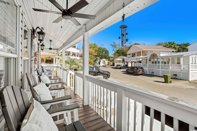 Wooden porch with ceiling fan and a residential view
