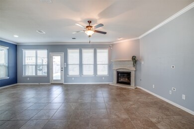 Straight ahead is the Family Room that enjoys a wall of windows for warm natural lighting.