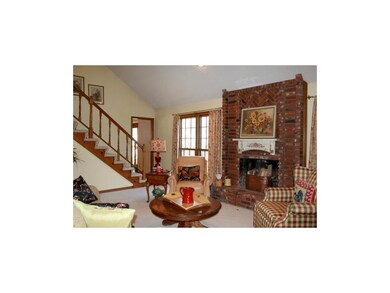 Warm family room w/ beautiful brick FP