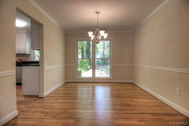 Dining room with chair rail, crown molding, new li