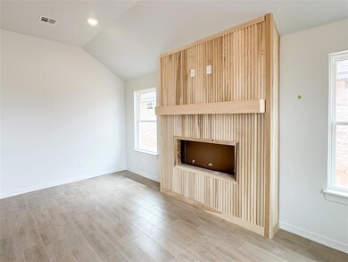 Unfurnished living room featuring vaulted ceiling,