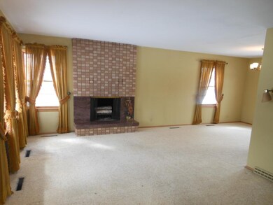 Spacious Living Room With Brick/Granite Fireplace.