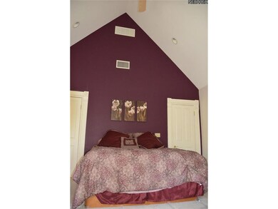 Vaulted ceiling in master bedroom.