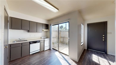 Kitchen with under cabinet range hood, white appli