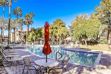 Community pool with a patio