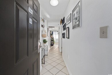 Hall with light tile patterned floors
