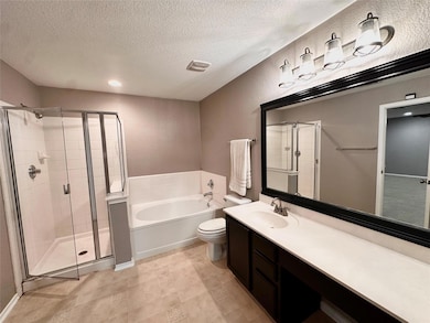Full bath with a textured wall, a textured ceilin
