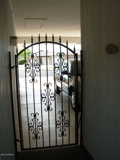 Gate from carport