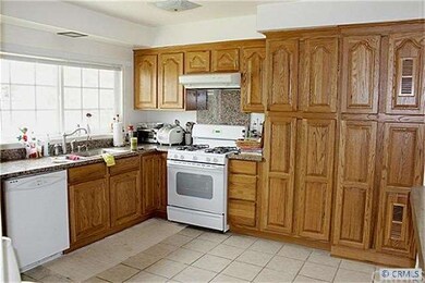 Kitchen with Granite and wooden cabinets