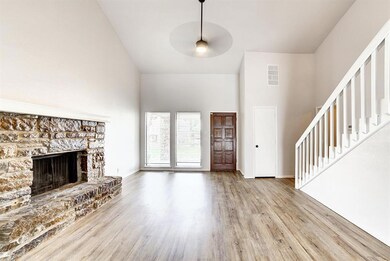 Unfurnished living room featuring light hardwood /