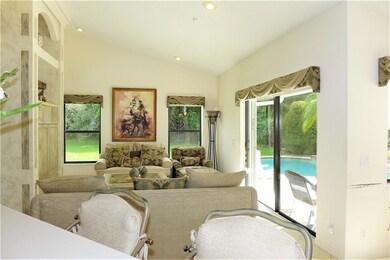View from the kitchen of living room & backyard. V
