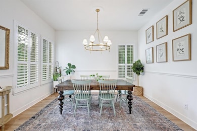 Dining area featuring wood finished floors, plent