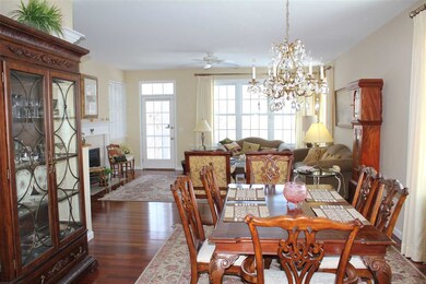 Open living/dining area. Beautiful wood floors.
