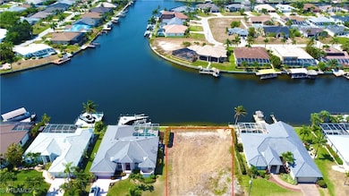 Bird's eye view featuring a water view and a resid