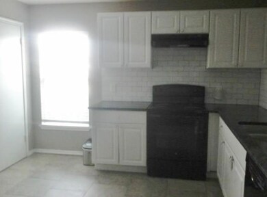 Tiled floor and backsplash.