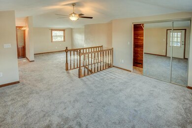 Large master bedroom with a sitting room.