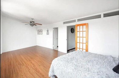 Bedroom featuring wood finished floors and ceiling fan