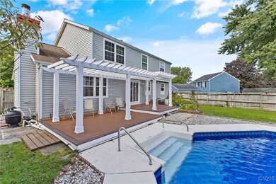 Spacious Trex deck with pergola overlooking your pool