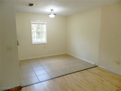 Unfurnished room featuring light tile patterned fl