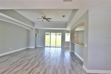 GREAT ROOM ENHANCED WITH COFFERED CEILINGS