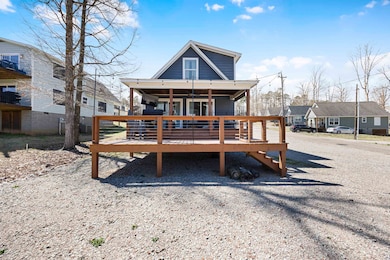 Rear view of house featuring a deck