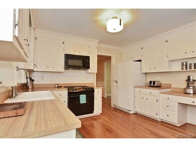 Spacious kitchen with planning desk and hardwood f