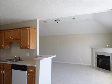 Kitchen opens to large Great room with fireplace.