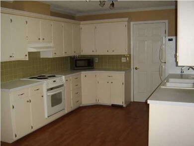 Kitchen is very open with a skylight that keeps it