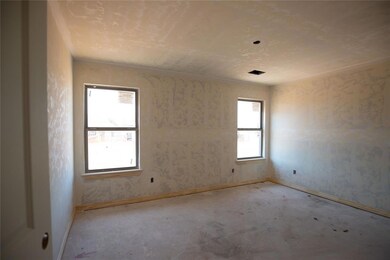 Unfurnished room featuring a healthy amount of sun