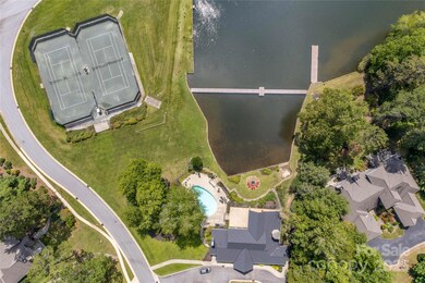 Overhead view of Lakehouse, Tennis Courts, Lake, and Pool