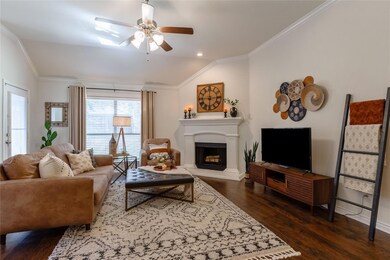 Living room with ceiling fan, dark hardwood / wood
