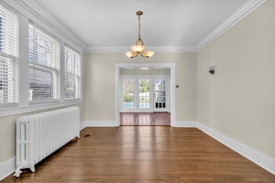 Dining room with french doors, refinished hardwood