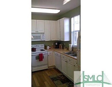 Kitchen. Fully furnished kitchen. Wood floors.