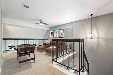 Playroom featuring a ceiling fan, carpet, and lof