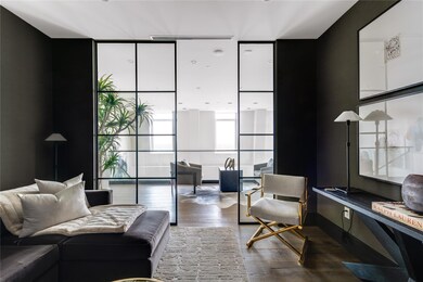 Glass-enclosed media room.