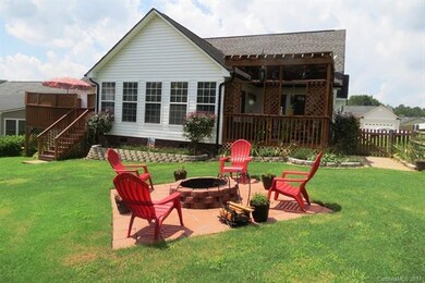 VIEW OF BACK OF HOME WITH A DECK ON EACH SIDE.  CO