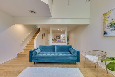 Living room featuring stairway, wood finished flo