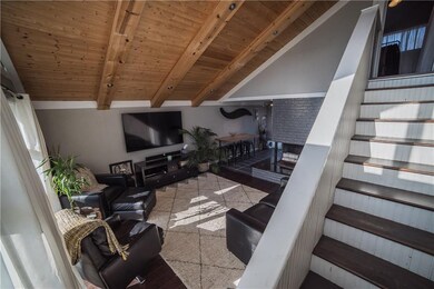 View of living room, fireplace, dining area and st